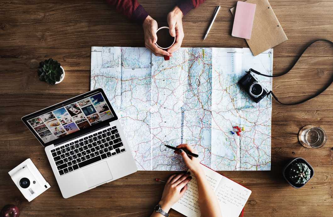 2 people planning a route on a map