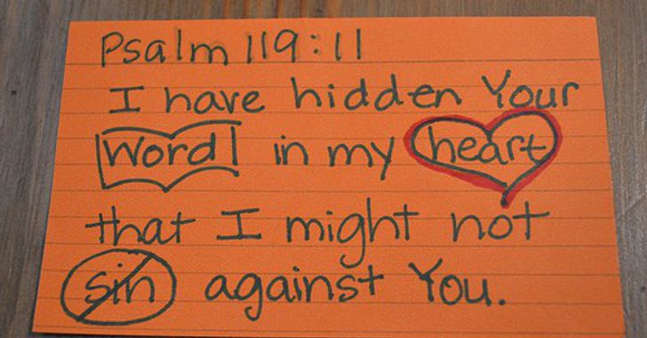 a bible verse written on an index card