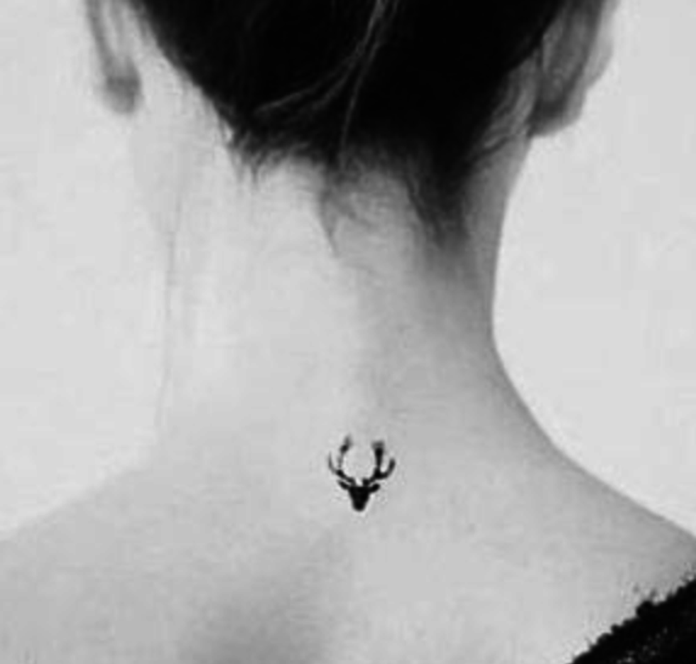 A deer tiny tattoo