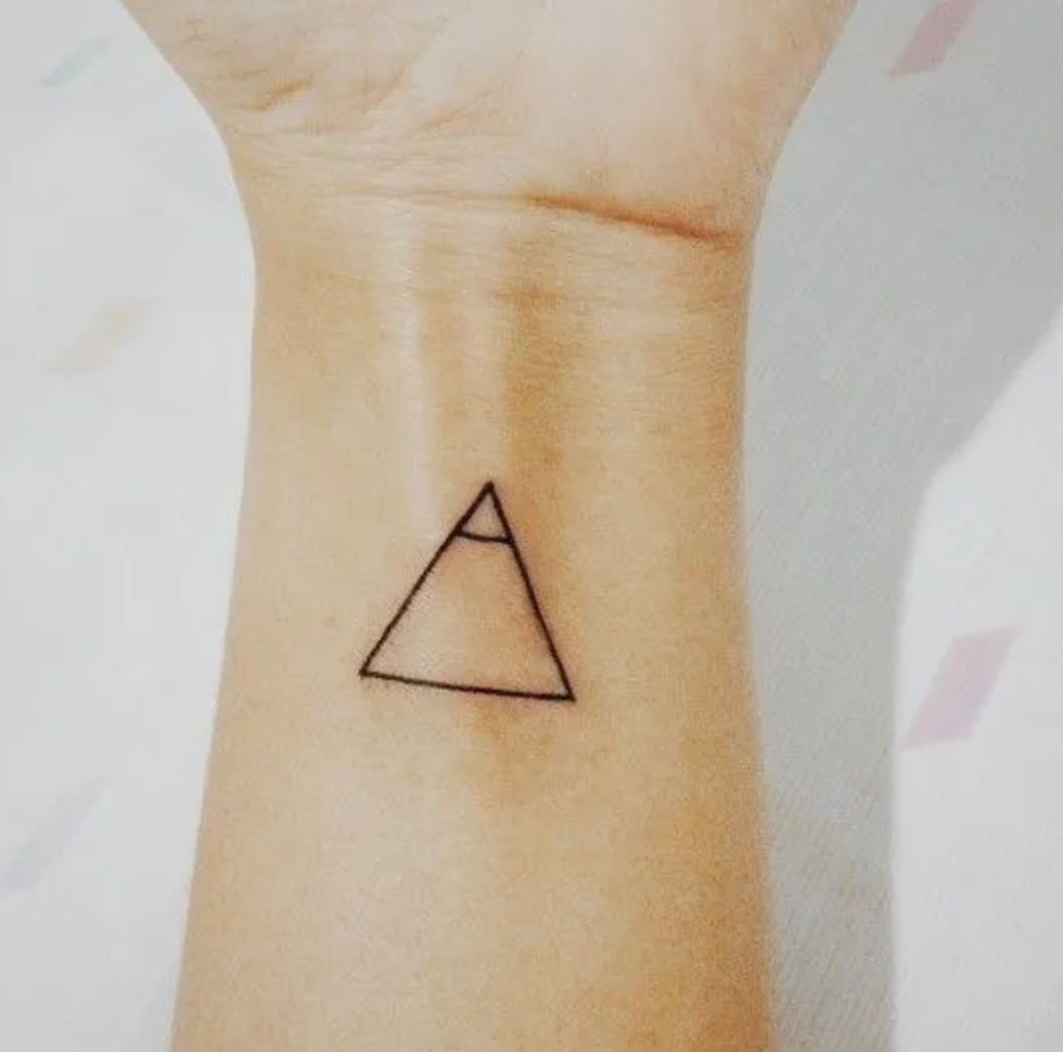A glyph tiny tattoo