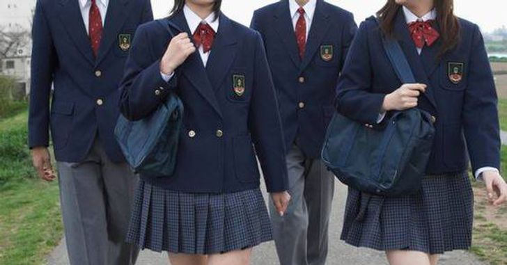 a group of students walking in uniform