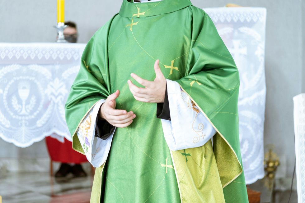 a man in a priest's outfit