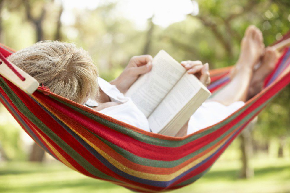 a person relaxing in a hammock
