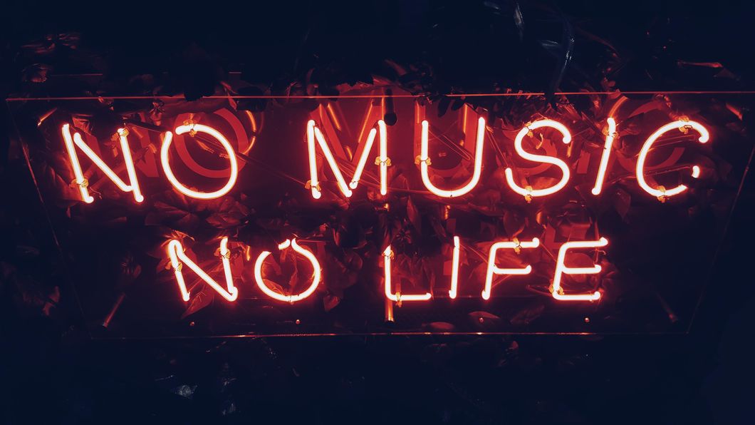 A red neon sign that says "No Music, No Life"