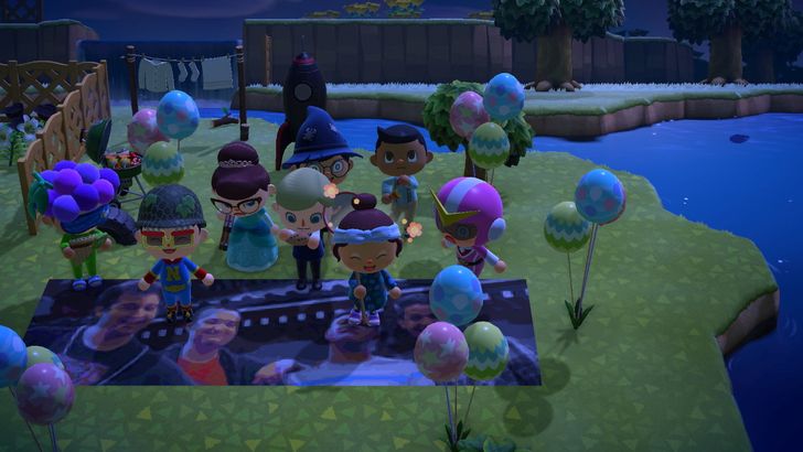 A screenshot of "Animal Crossing: New Horizons" on the Nintendo Switch shows eight characters posing for the camera and they all have different expressions.