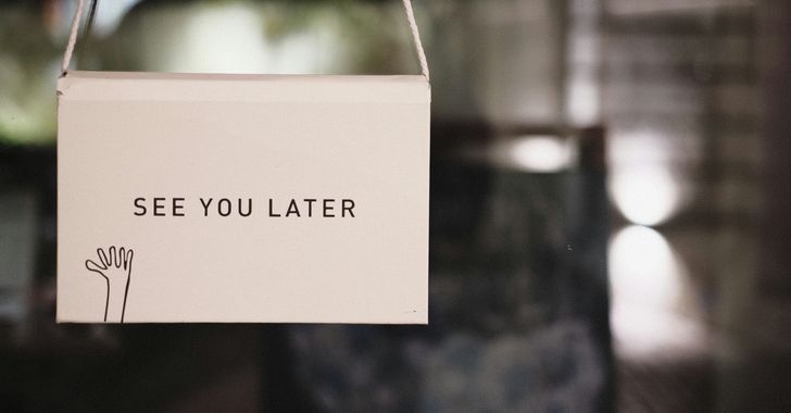 a sign that says see you later hanging from a door