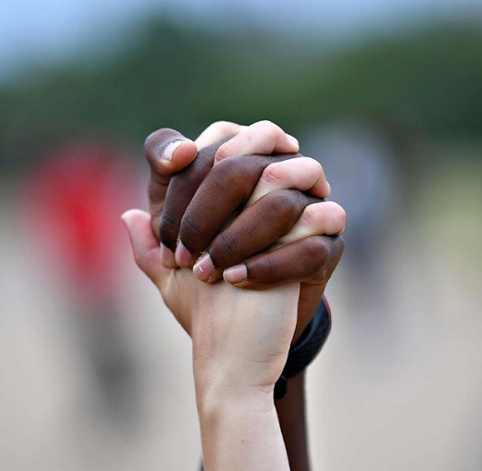 abc news protest hand hold