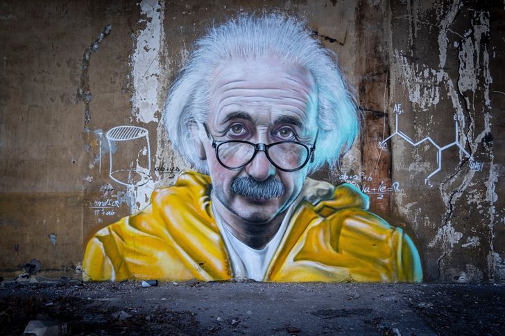 Albert Einstein depicted wearing yellow coat and eyeglasses