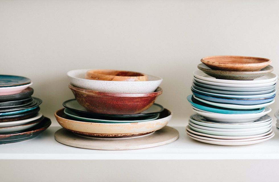assorted-color ceramic plates and saucers