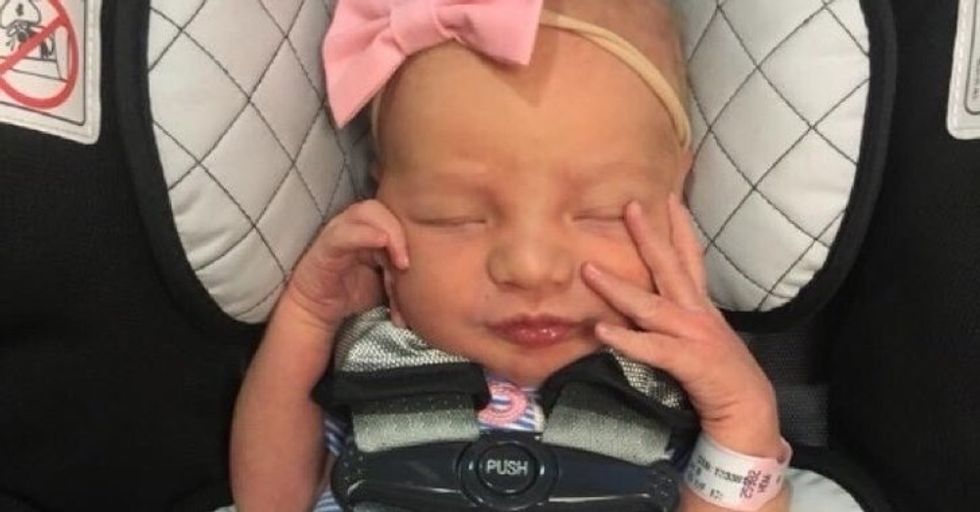 baby girl in baby seat