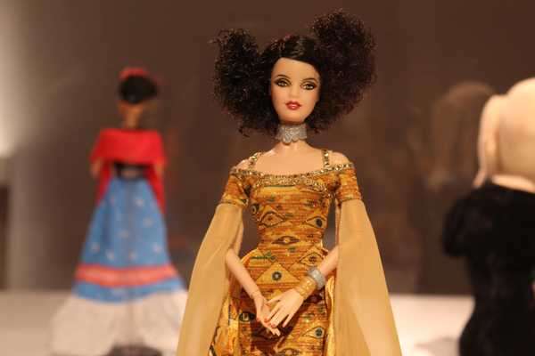 barbie doll in gold floral dress