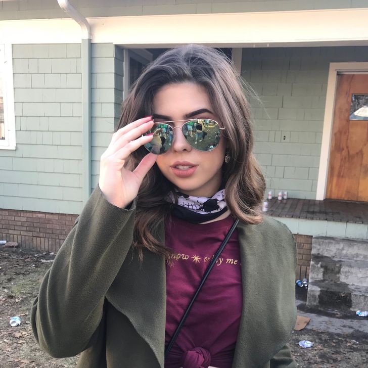 beautiful college girl wearing green sunglasses