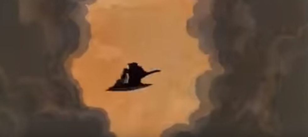 Belle and the Beast riding the magic carpet.