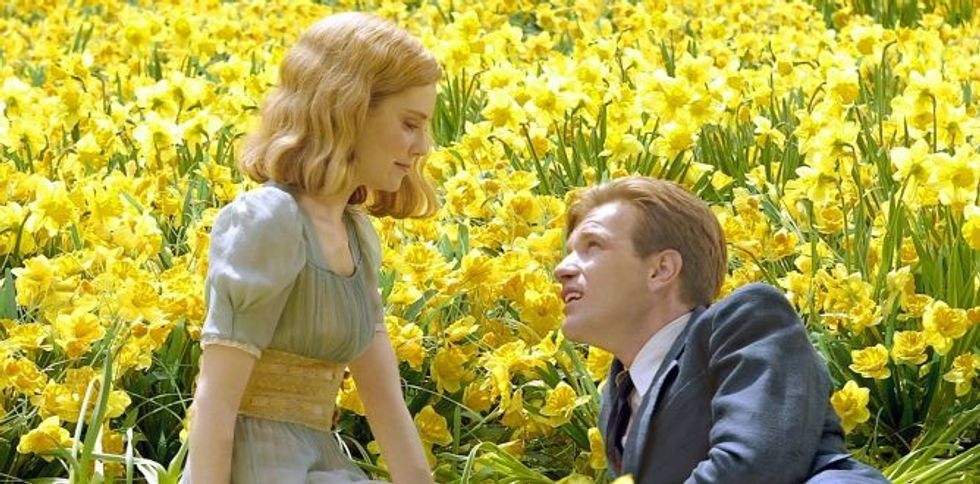 Big Fish movie - Man and lady sitting in a field of daffodils