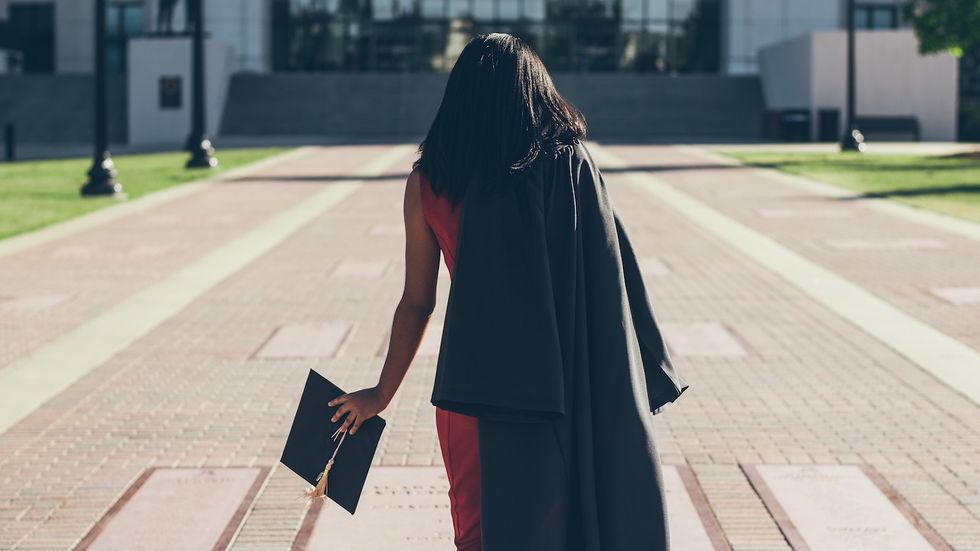black woman at college graduation