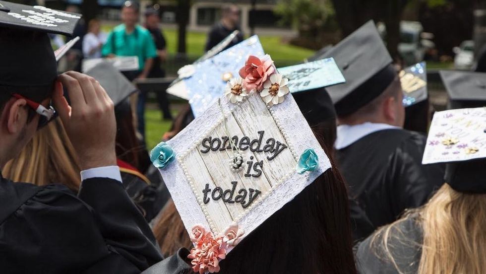 blonde woman with glasses drinking from starbucks cups