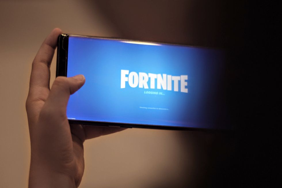 Blue phone screen that says 'Fortnite'