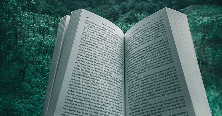 book open in nature setting