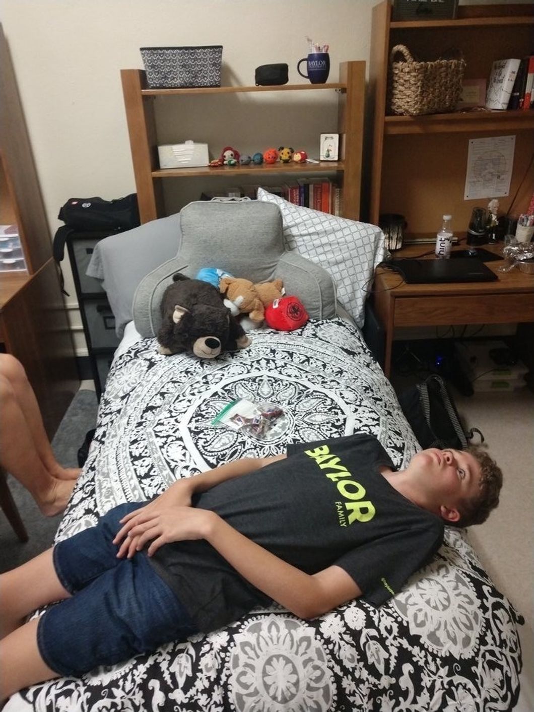 boy staring on a bed