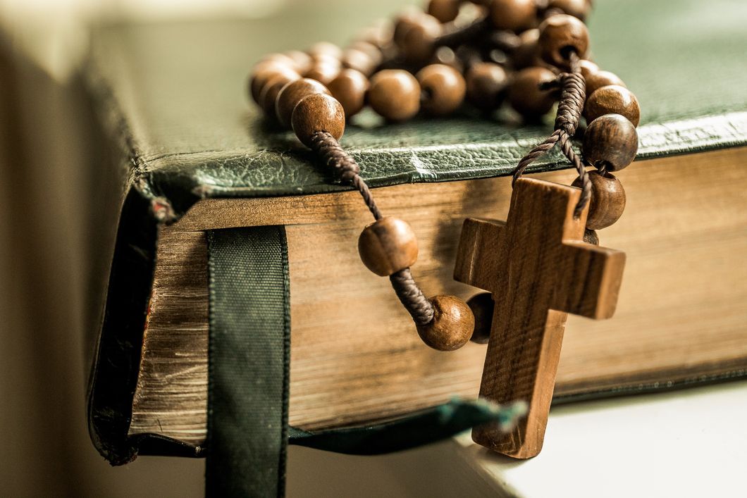 Brown Rosary and Holy Bible