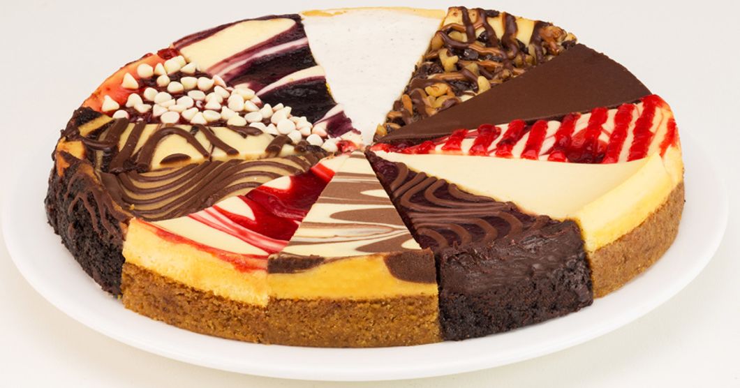 Cake with different flavor slices and topings on a plate