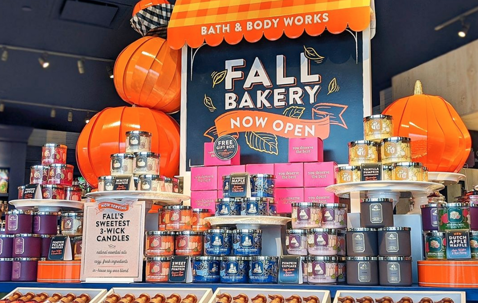 candles inside the bath and body works store with a sign reading "fall bakery now open"