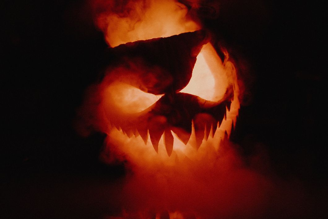 Carved pumpkin with smoke inside