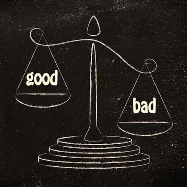 Chalk drawing of scales weighing "good" and "bad" on a blackboard.