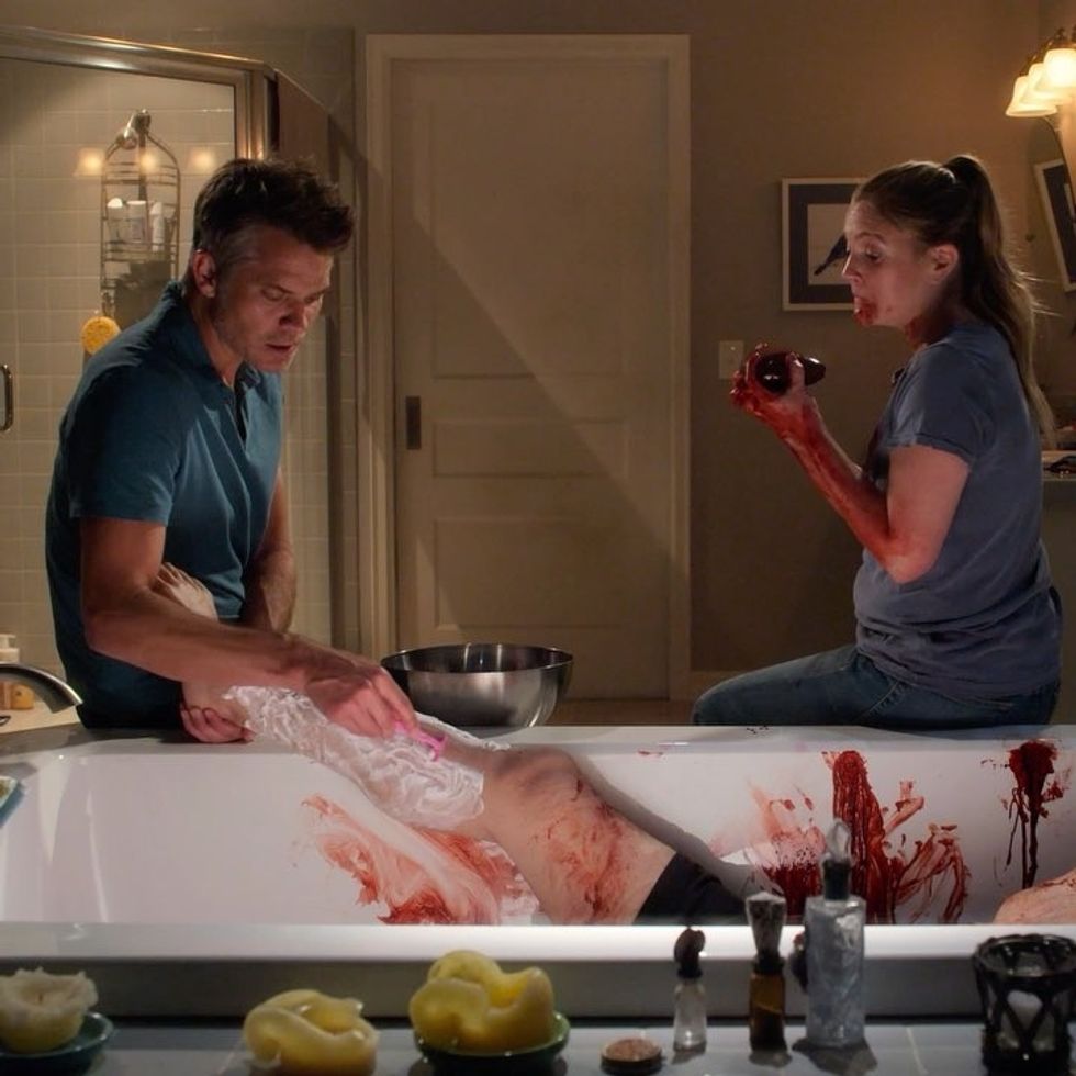 Characters from Santa Clarita Diet digging hole holding a head