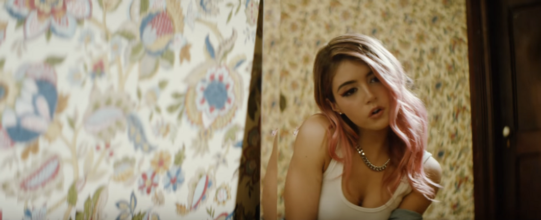 Chrissy Costanza in the music video for "Voices"
