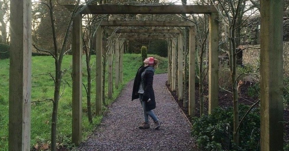 christian woman standing in park