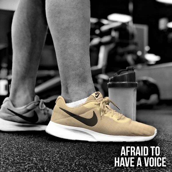 close up of a Nike shoe, with the picture in black and white but one shoe in full color for emphasis