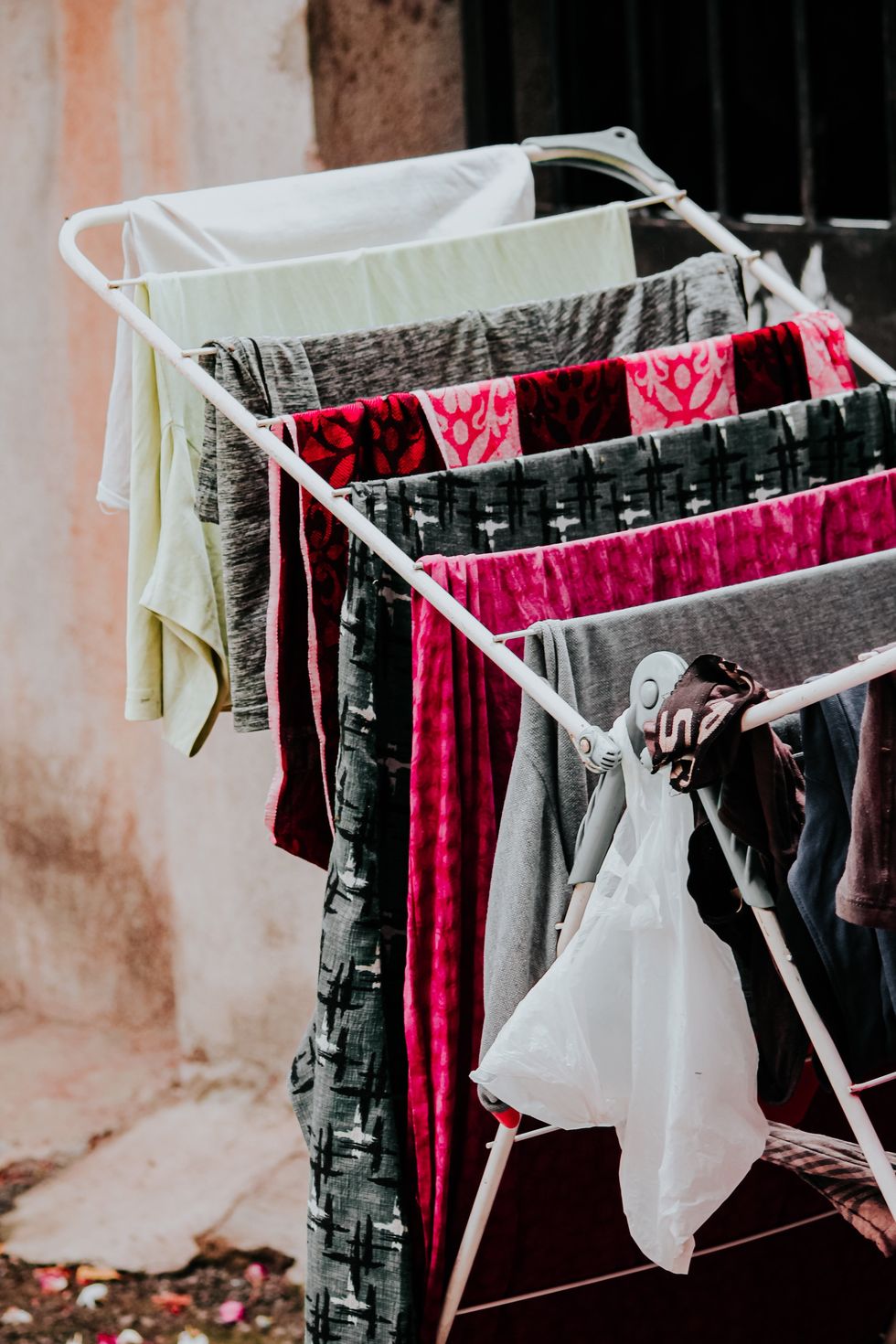 Clothes drying on a drying rack.