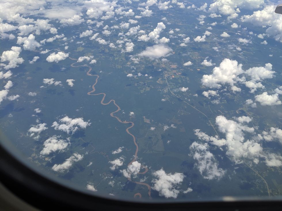 Clouds, river and farms from the air