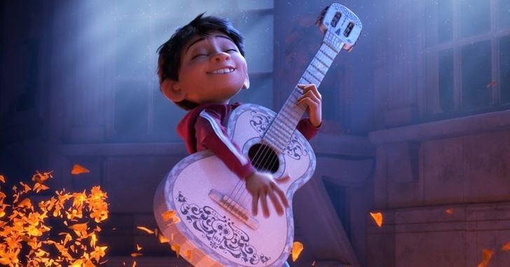 Coco movie - Animated boy playing a guitar