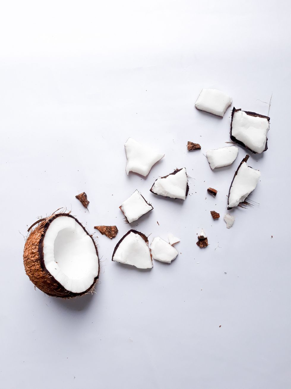 Coconut cut up into pieces.