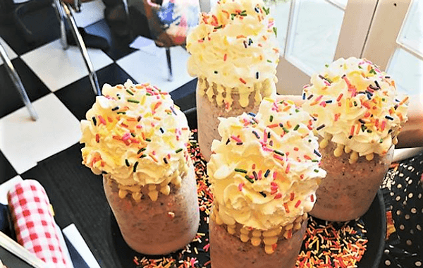 coffee shakes with whipped cream and sprinkles