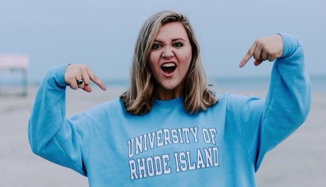 college girl wearing university of rhode island shirt