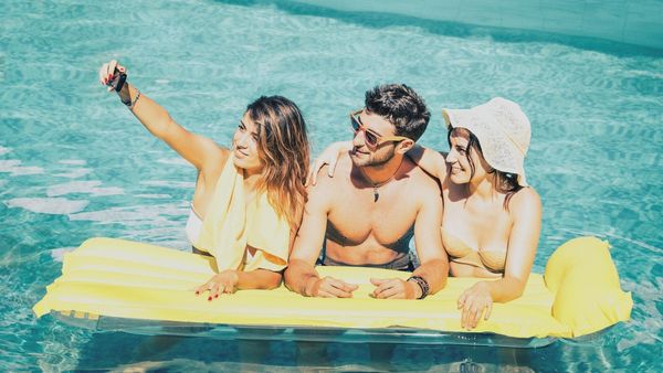 college students in swimming pool