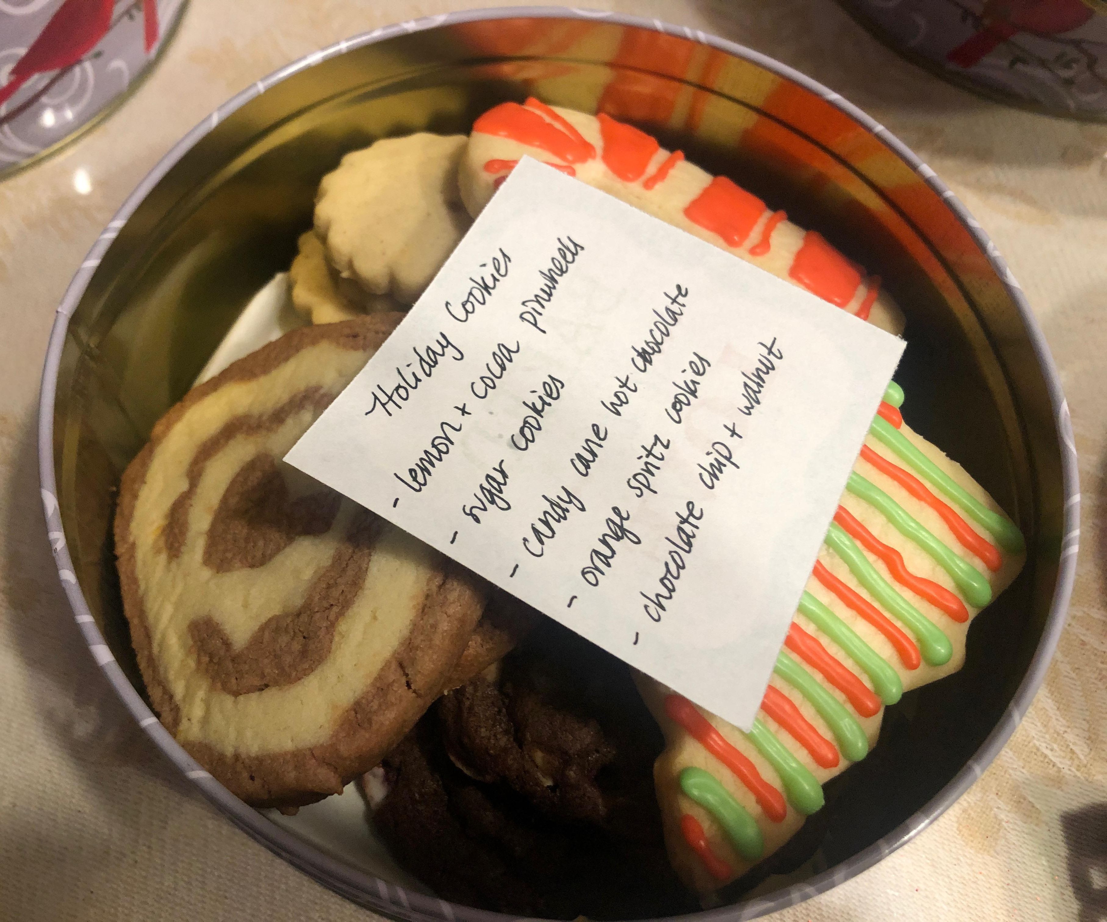 Cookies assembled in a tin with a white tag on top