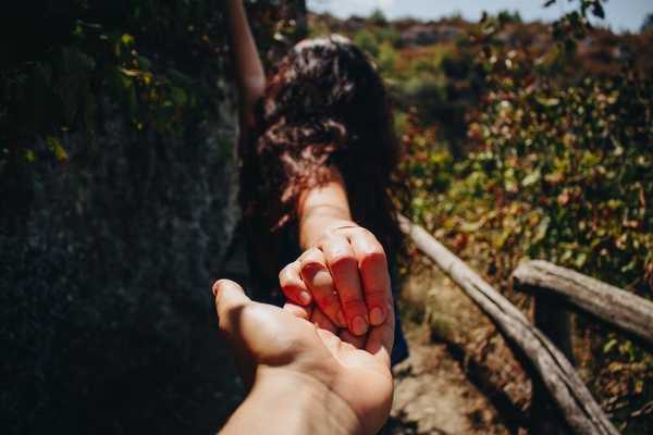 couple holding hands outside