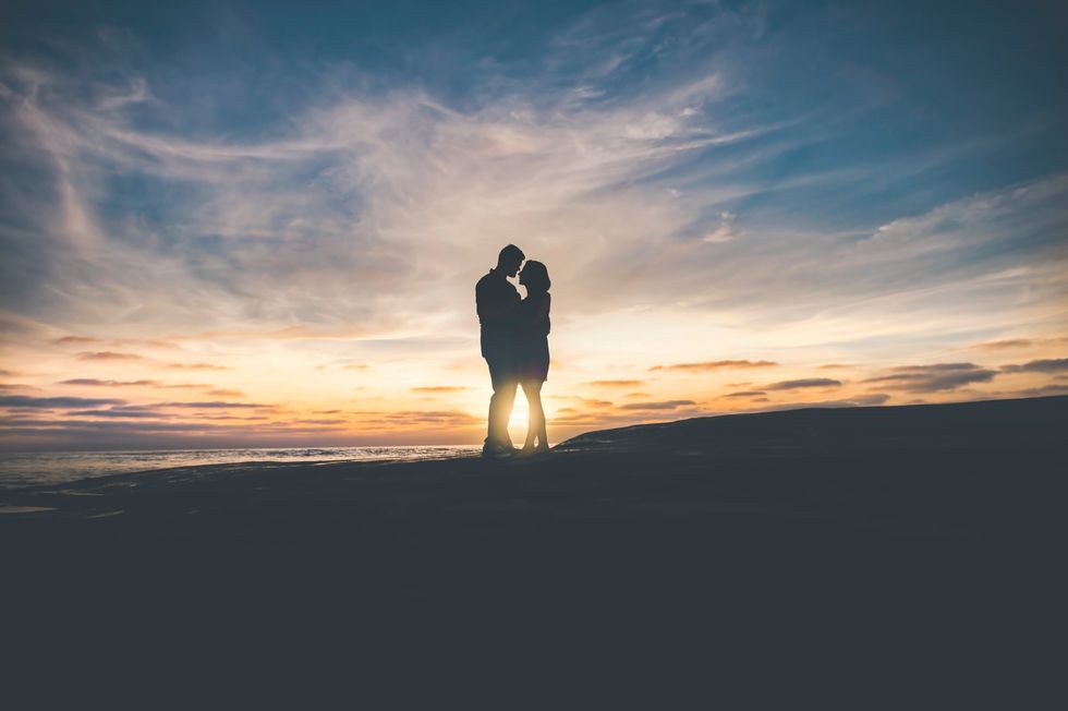 couple standing in the sunset