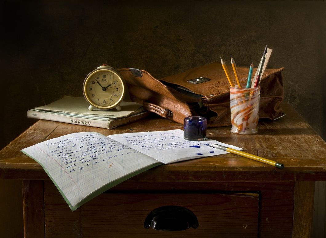 Desk, clock, pencil, journal, book, pen, watch
