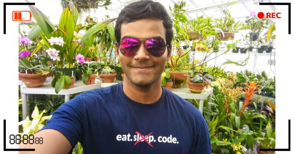 Dhruvil in front of plants