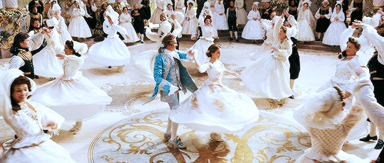 Belle and her prince dance with the French elite.