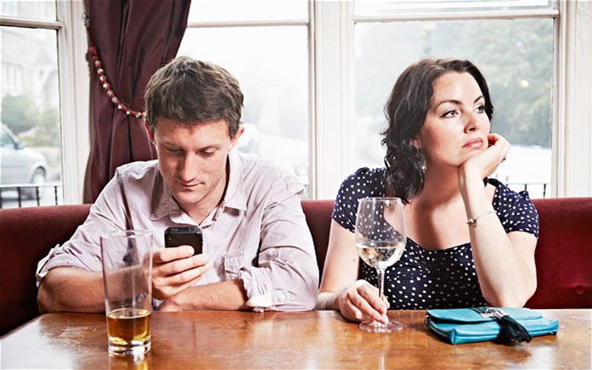 Why Looking At Your Phone During A Conversation Hurts Us All