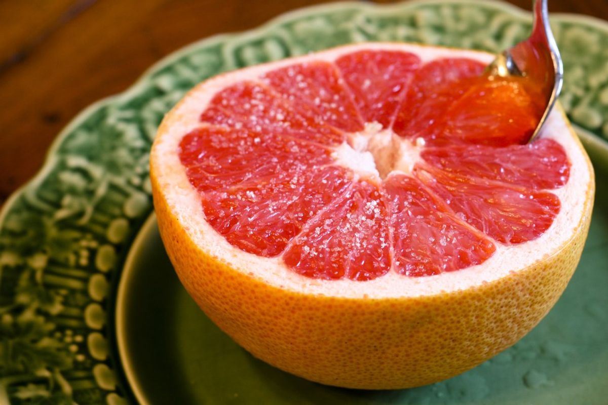 Putting Sugar On Grapefruit