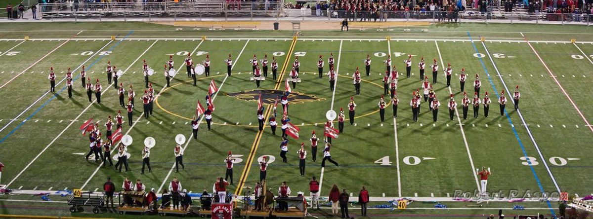 Band says thank you to band director in musical performance