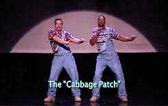 2 men in overalls dancing the cabagge