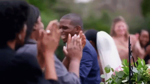 Greg and Deonna from "Married At First Sight" walking down the wedding aisle